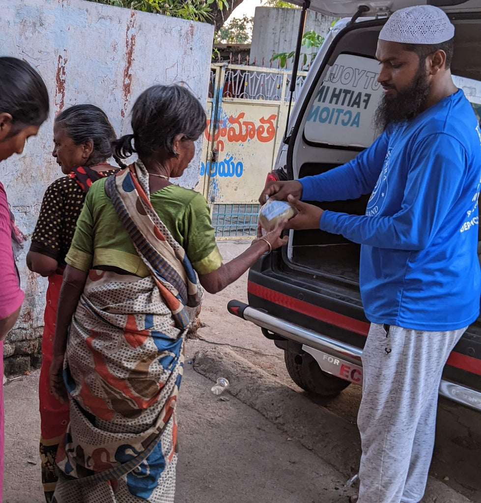 Hyderabad, India - Participating in Mobile Food Rescue Program by Distributing Hot Meals to Local Community's Less Privileged Families