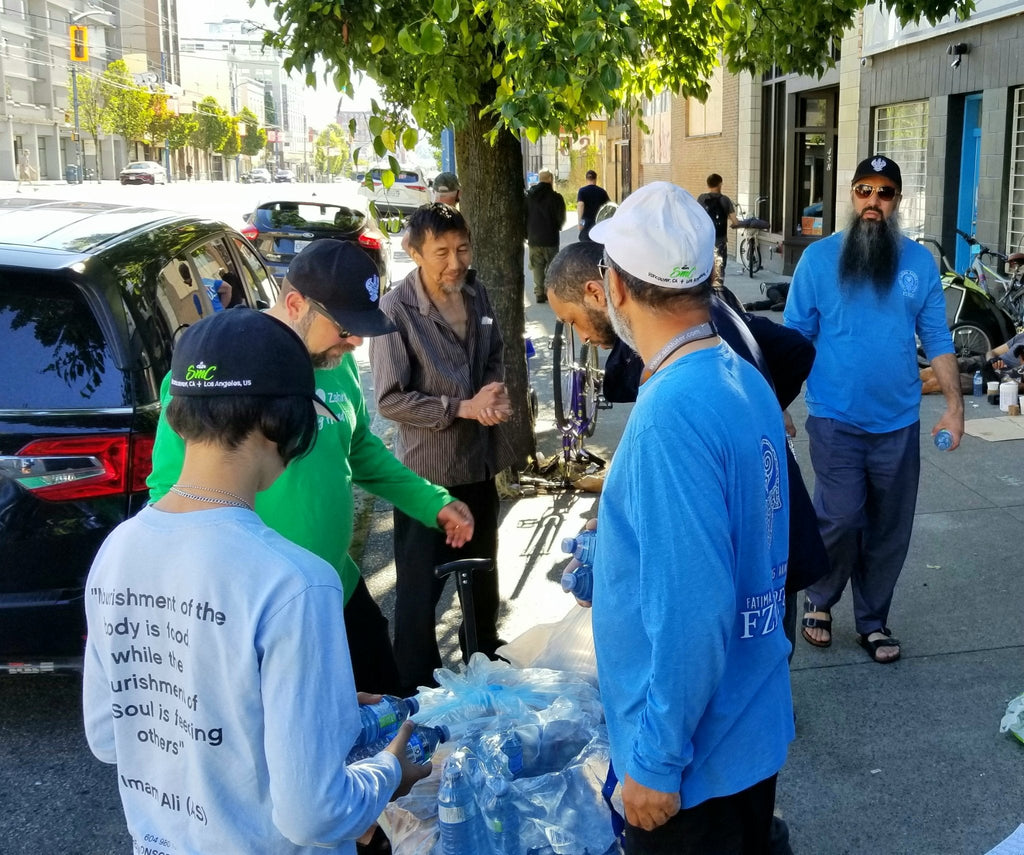 Vancouver, Canada - Honoring Ashura/Tenth Day of Holy Month of Muharram & Shahadat/Martyrdom of Sayyidina Imam Hussein (AS) & Martyrs (AS) of Karbala by Distributing 700+ Water Bottles & Lunch Snacks to Homeless Shelters & Less Privileged People