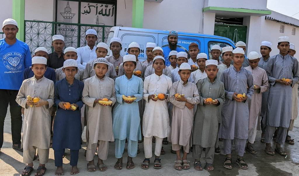 Hyderabad, India - Participating in Mobile Food Rescue Program by Distributing Fresh Fruits to Local Community's Madrasa/School Children & Less Privileged People