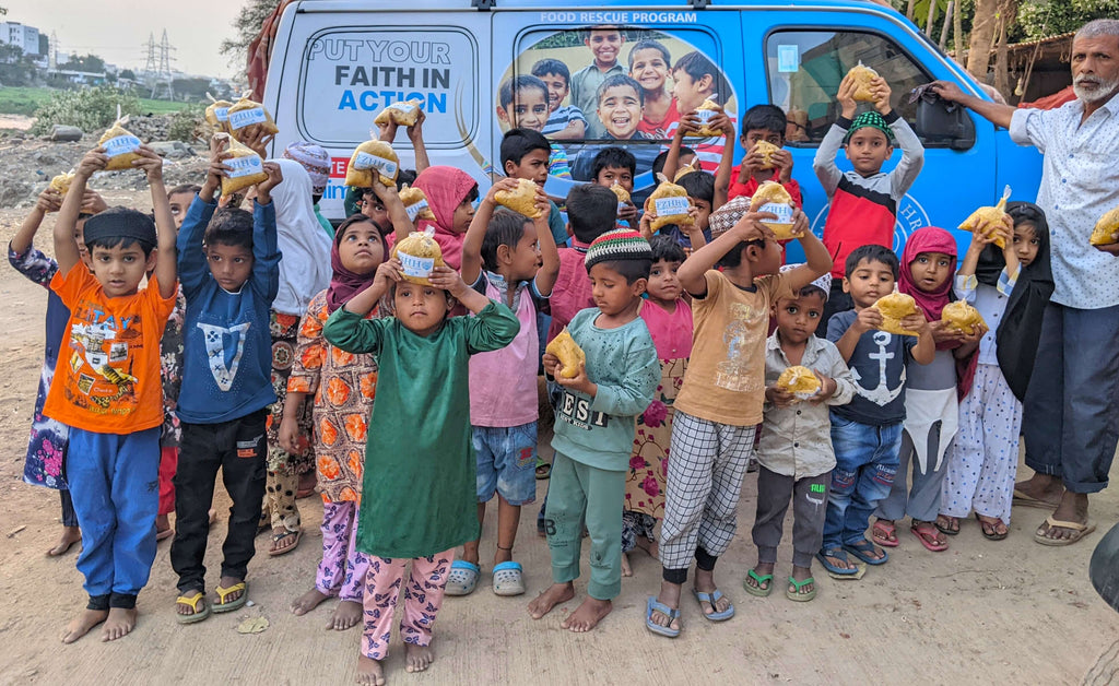 Hyderabad, India - Participating in Mobile Food Rescue Program by Distributing Hot Meals to Homeless & Less Privileged Families and Madrasa Students