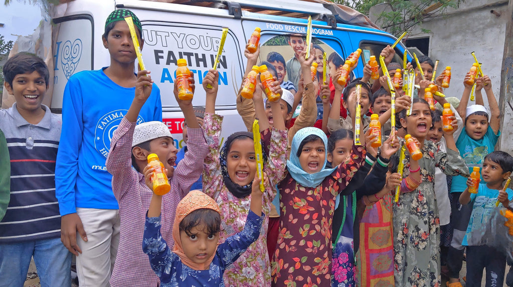 Hyderabad, India - Participating in Mobile Food Rescue Program by Serving Hot Meals to Madrasa Students & Distributing Juices & Candies to 150+ Less Privileged Children