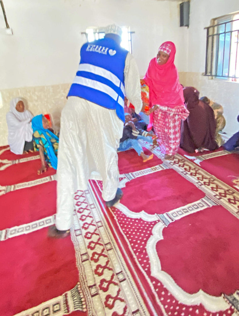 Abuja, Nigeria - Participating in Mobile Food Rescue Program by Distributing Candy & Footwear to Less Privileged Children & Rice Bags to Less Privileged Women