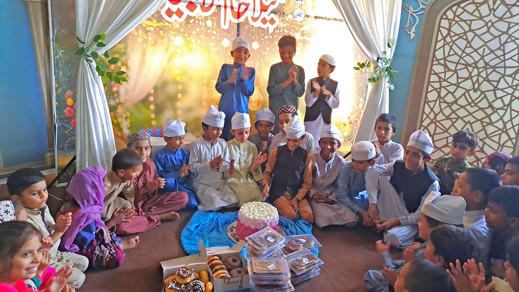 Lahore, Pakistan - Participating in Orphan Support & Mawlid Support Programs by Celebrating ZikrAllah & Mawlid an Nabi ﷺ, Serving Hot Meals with Blessed Birthday Cake & Distributing Blessed Gifts to Beloved Orphans & Less Privileged Children