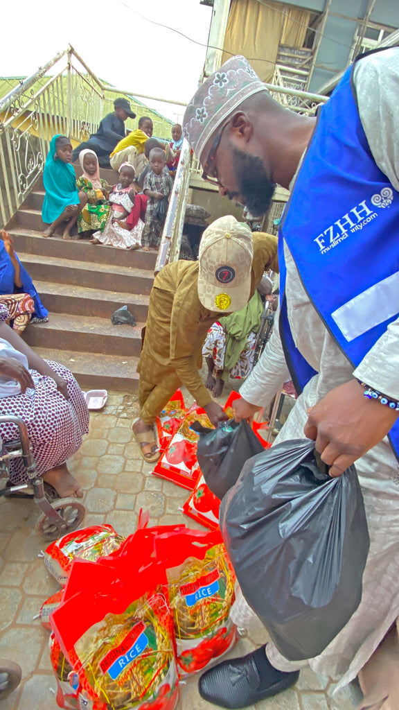 Abuja, Nigeria - Participating in Mobile Food Rescue Program by Distributing Sweets & Footwear to Less Privileged Children & Rice Bags to Less Privileged Women Living with Disabilities