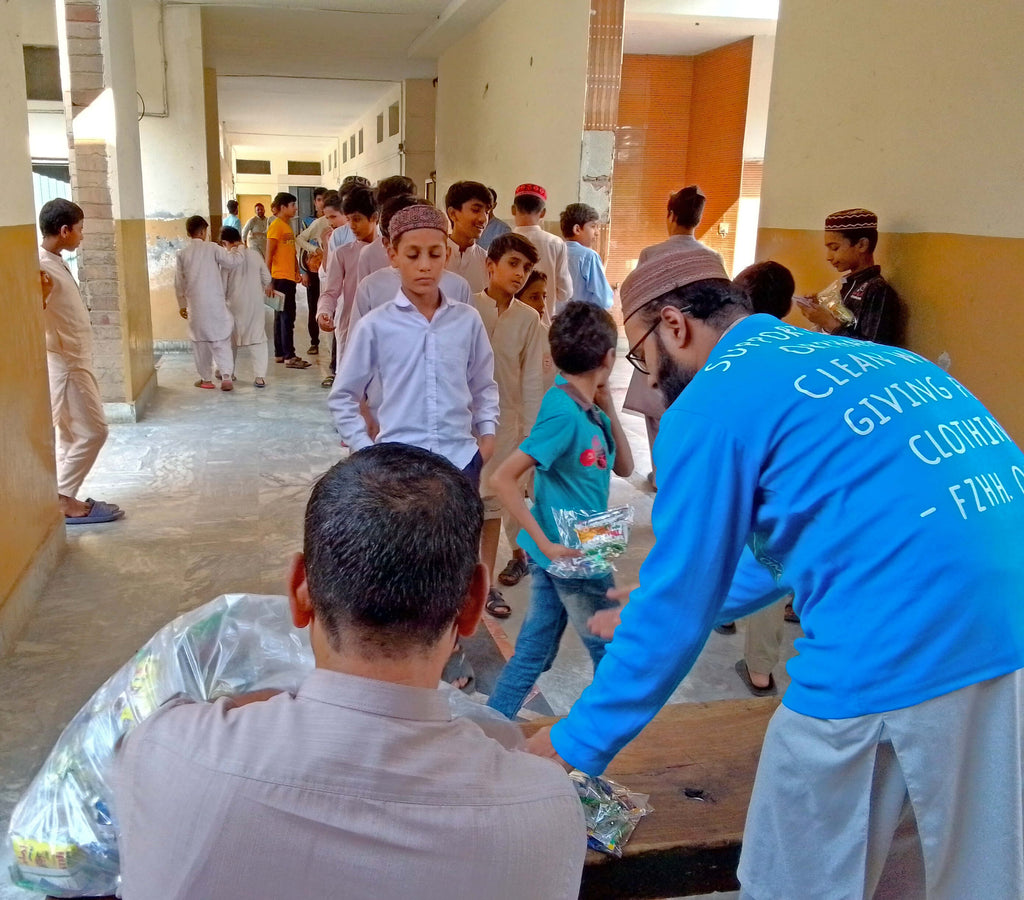 Faisalabad, Pakistan - Participating in Orphan Support Program & Mobile Food Rescue Program by Distributing Goodie Bags Filled with Snacks, Chocolates & Candies to 110+ Beloved Orphans & Less Privileged Children at Local Community's Orphanage