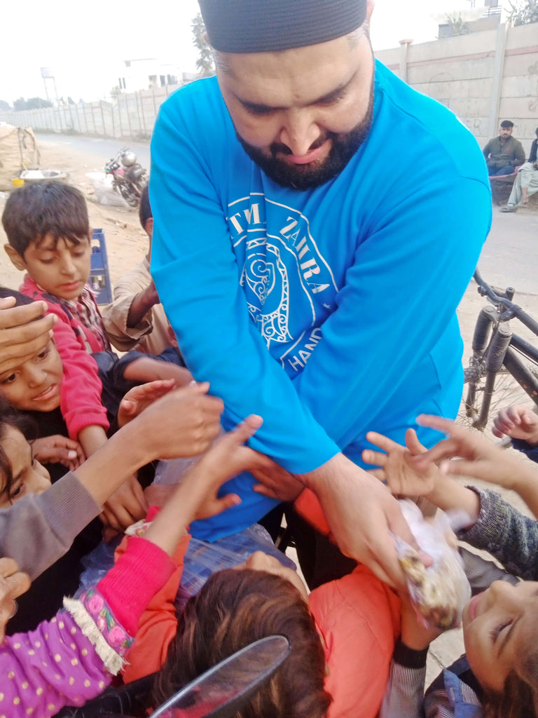 Lahore, Pakistan - Participating in Mobile Food Rescue Program by Preparing, Packaging & Distributing Hot Meals & Fruit Juices to 100+ Less Privileged Children & Adults