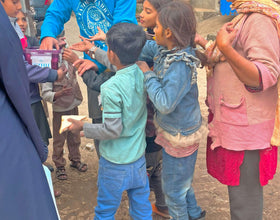 Faisalabad, Pakistan - Participating in Mobile Food Rescue Program by Serving Homemade Sandwiches to 110+ Less Privileged Children & Adults