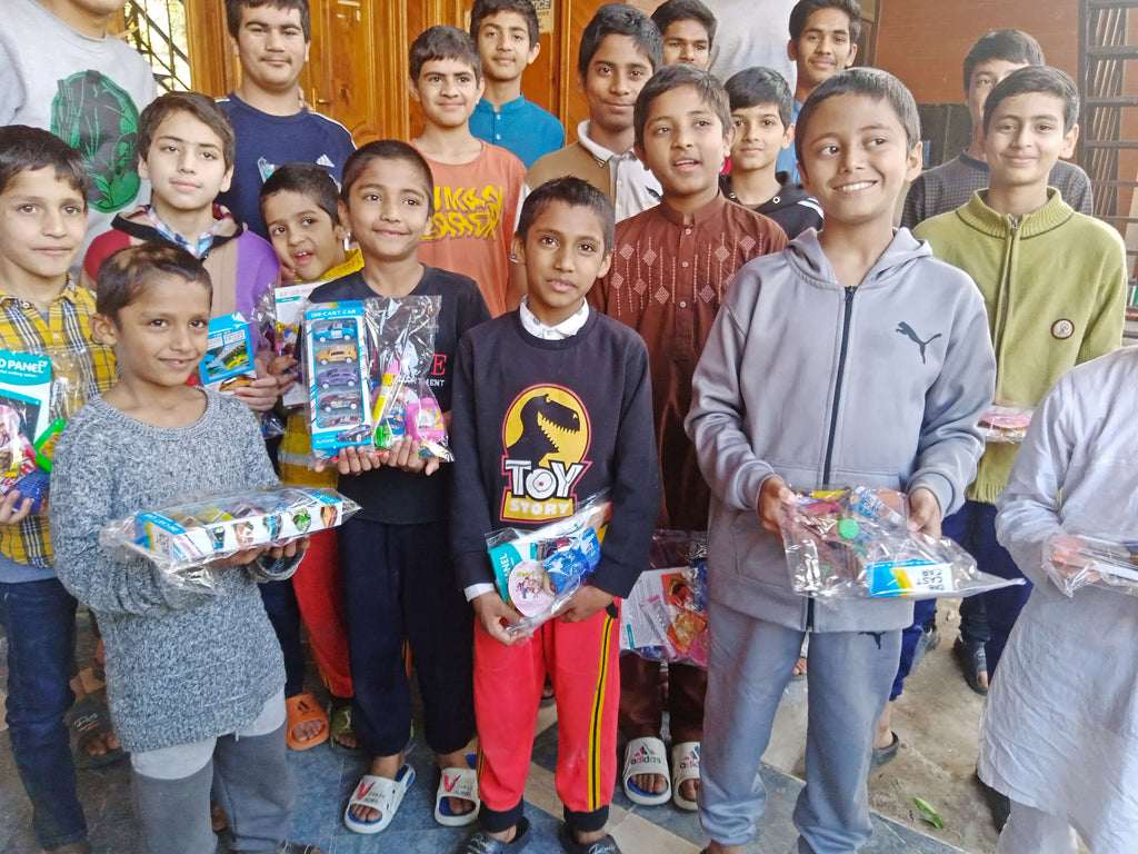 Lahore, Pakistan - Participating in Orphan Support Program by Distributing Essential School Books & Stationery Supplies and Goodie Bags Filled with Candies & Toys to Beloved Orphans at Local Community Orphanage