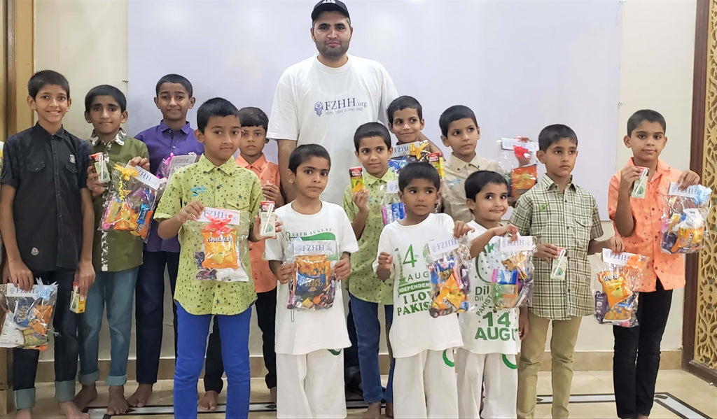 Sharing Pizza Lunch & Goodies Bag with Our Beloved Orphans to Honor Holy Arbaeen – PK
