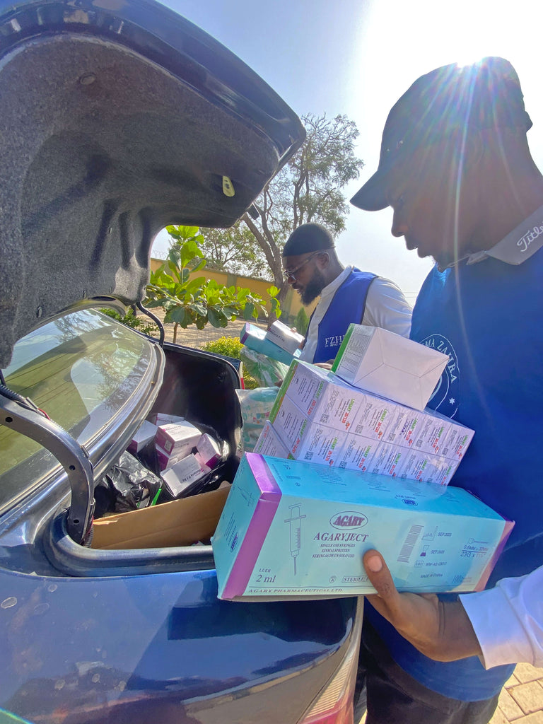 Abuja, Nigeria - Participating in Pediatric Medical Outreach Program & Mobile Food Rescue Program by Distributing Essential Pediatric Consumable Supplies & Anti-Malaria Medications with Candies to Less Privileged Children & Adults at Local Health Center