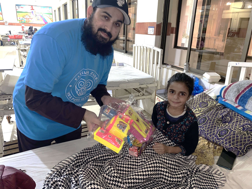 Lahore, Pakistan - Participating in Orphan Support Program by Distributing Goodie Bags Filled with Snacks & Toys to Admitted Children at Pediatric Surgery Ward of Local Community's Children's Hospital