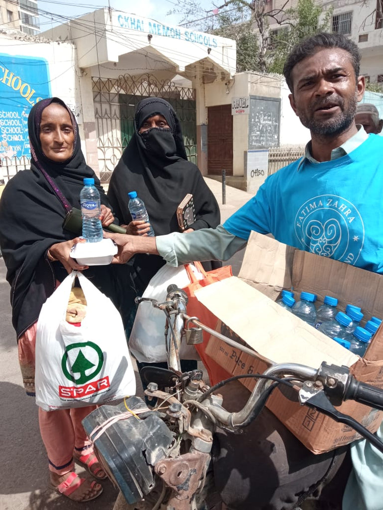 Karachi, Pakistan - Participating in Mobile Food Rescue Program by Distributing Hot Meals to Local Community's Homeless & Less Privileged People