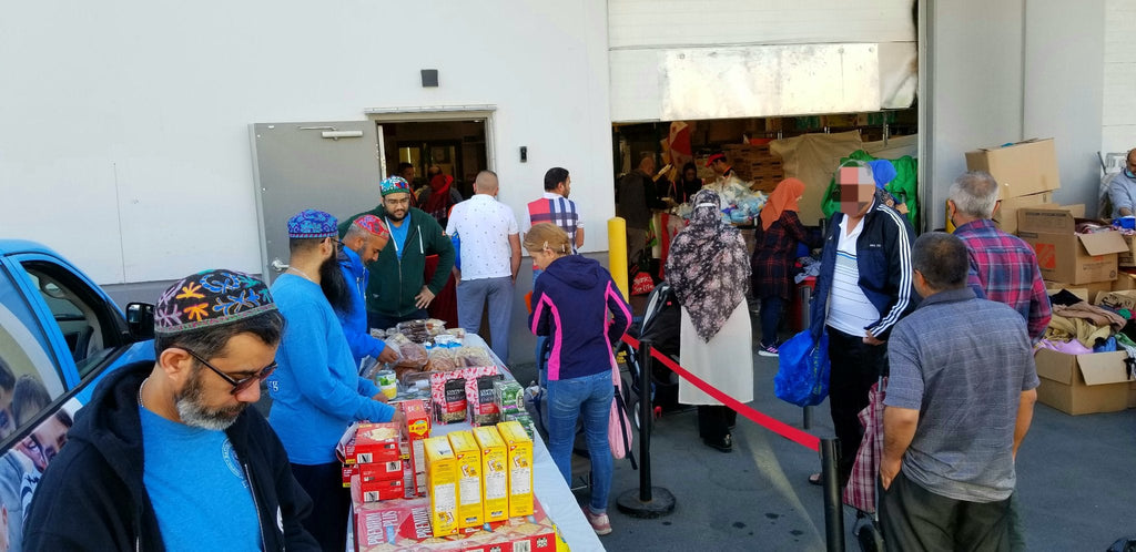 Canada - Honoring Holy Second Day of Dhul Hijjah & the Holy Marriage of Sayyiditina Fatima az Zahra ع & Sayyidina Imam Ali ع by Distributing Essential Groceries to 100+ Refugee Families at Community's Muslim Food Bank