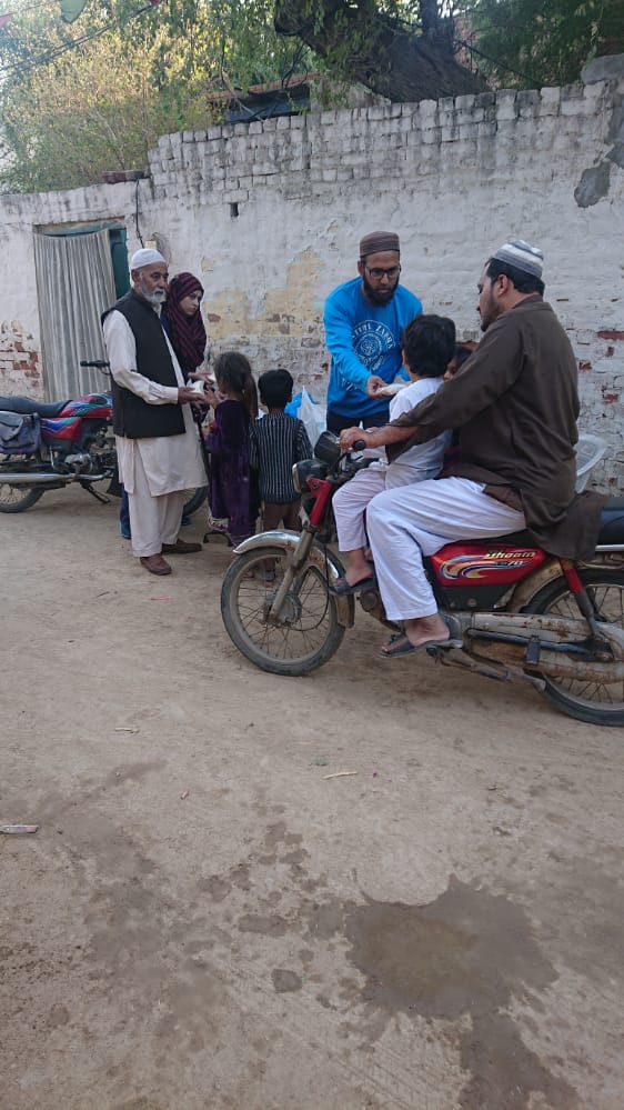 Faisalabad, Pakistan - Participating in Mobile Food Rescue Program by Distributing Home Cooked Sandwiches to Local Community's Less Privileged Children & Families