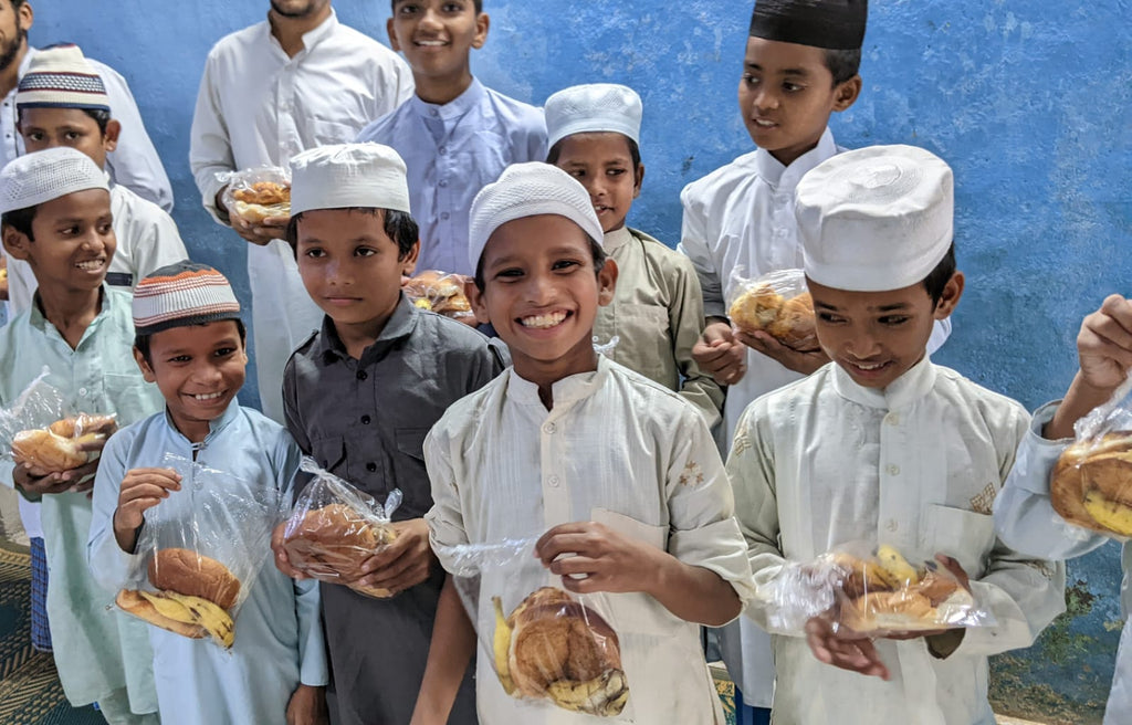 Hyderabad, India - Honoring Ninth Day of Holy Month of Muharram & Shaykh Nurjan's Teachings by Distributing Bakery Snacks & Fresh Fruit to Local Community's Homeless & Less Privileged People