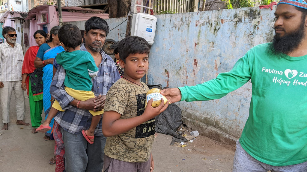Hyderabad, India - Participating in Mobile Food Rescue Program by Distributing Hot Meals to Local Community's Less Privileged Children & Families