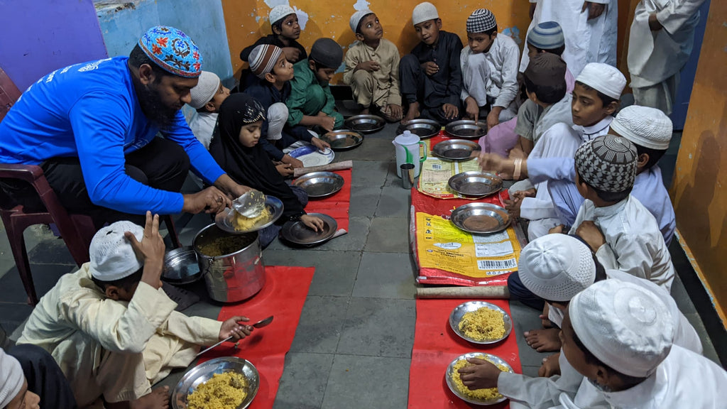 Hyderabad, India - Participating in Mobile Food Rescue Program by Serving Hot Meals to Children at Two Local Madrasas/Schools & Distributing to Less Privileged People